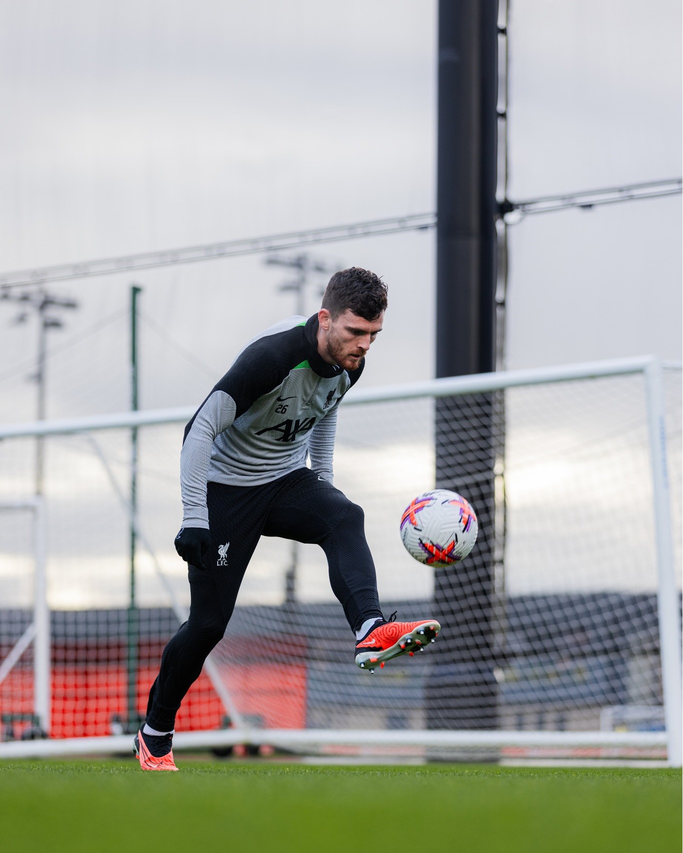 May be an image of 1 person, playing football, playing American football and studded shoes