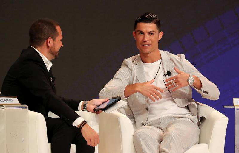 DUBAI, UNITED ARAB EMIRATES, Dec 28 – 2019 :- Left to Right - Rui Pedro, TV Sports Analyst and Cristiano Ronaldo, Juventus FC & Portuguese National Team Player during the 14th Dubai International Sports Conference held at Madinat Jumeirah in Dubai. ( Pawan Singh / The National ) For Sports/Instagram. Story by John