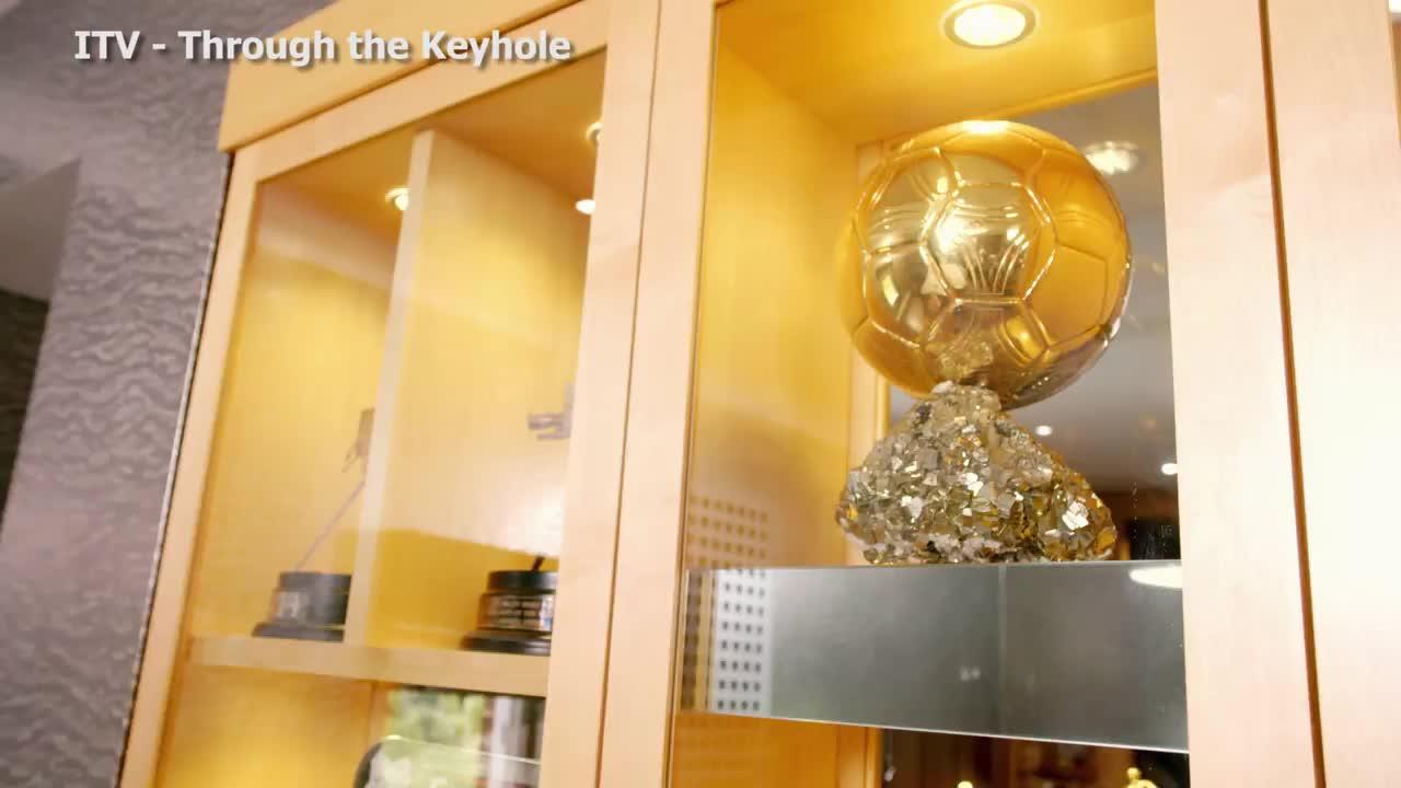  Owen's Ballon d'Or trophy sits on a spinning surface under a spotlight