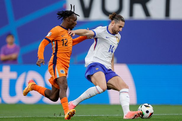 Jeremie Frimpong of Holland, Adrien Rabiot of France during the EURO match between Holland v France at the Red Bull Arena on June 21, 2024 in Leipzig Germany.