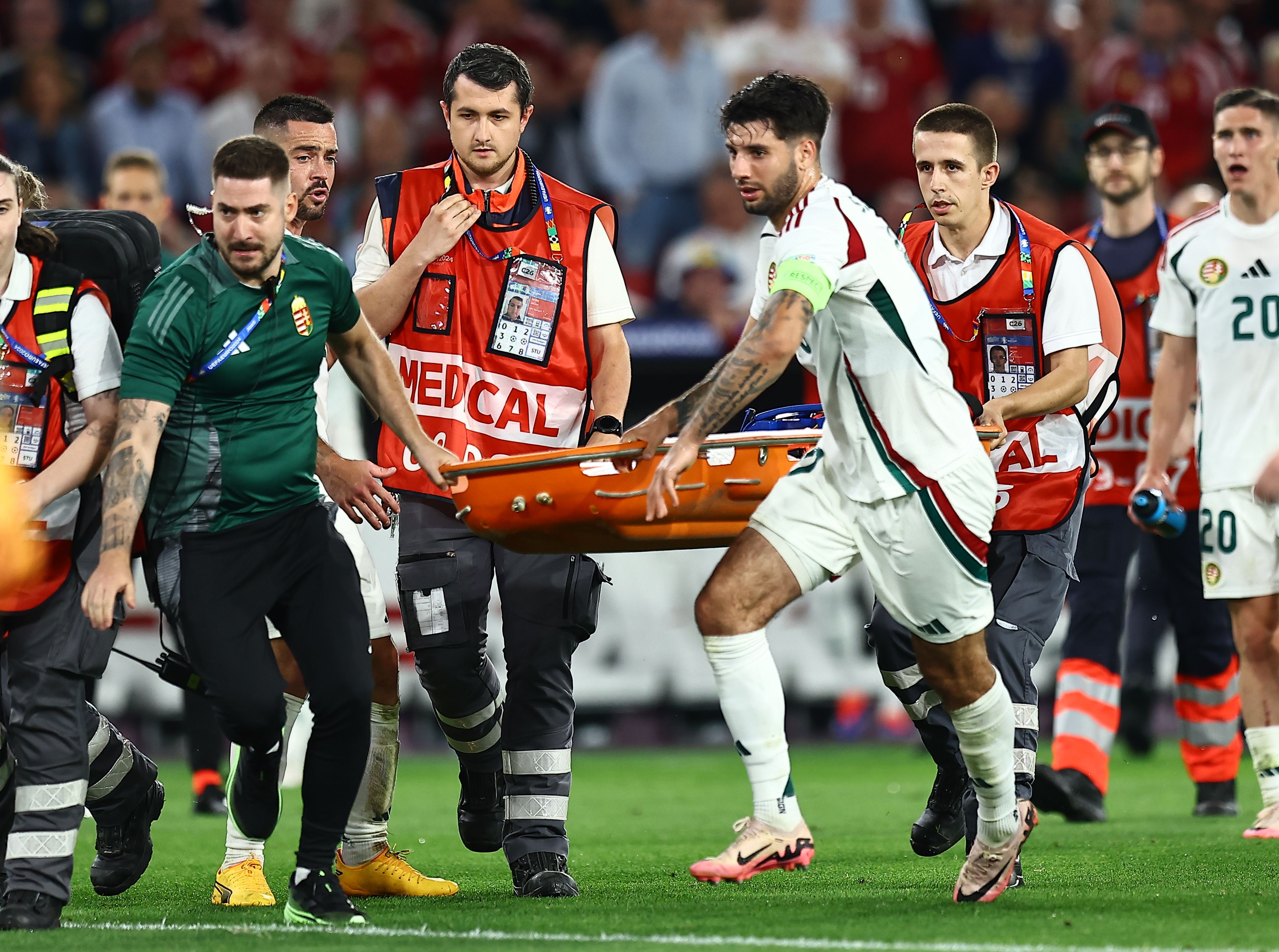Hungary captain Dominik Szoboszlai helped carry the stretcher onto the pitch